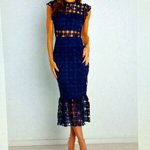 Never worn. NWT, size 6, navy blue